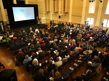 Crowd gathered at a Refugee Week event