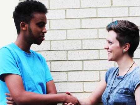 Abdi and Naomi shaking hands