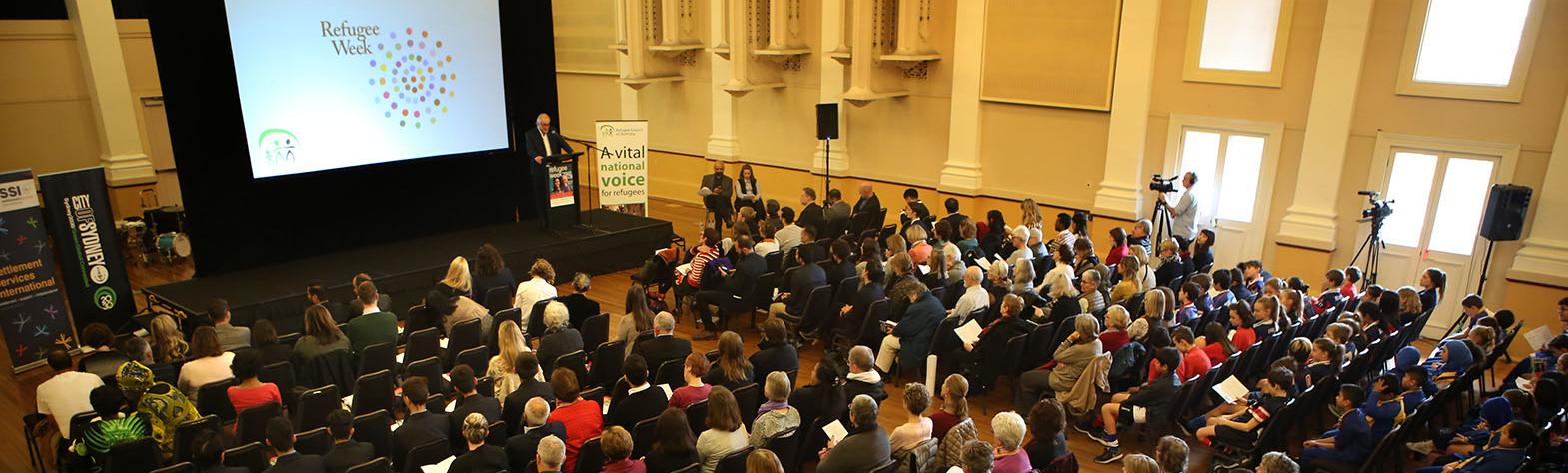 Crowd gathered at a Refugee Week event