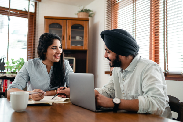 two people talking over table