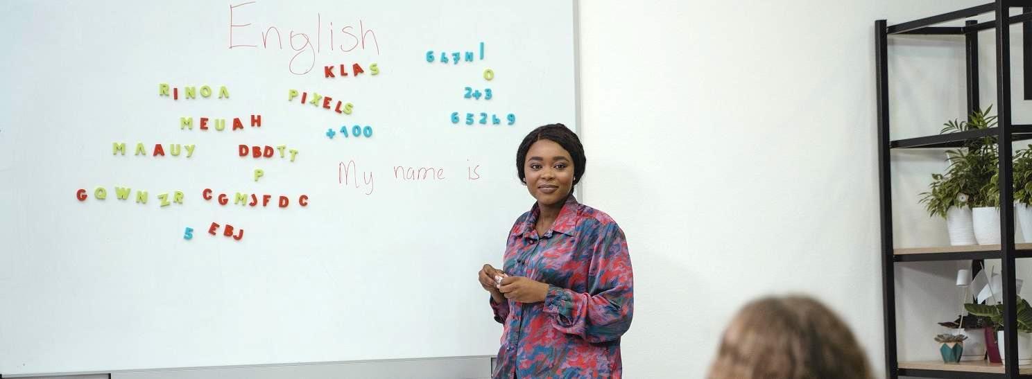 person standing at whiteboard