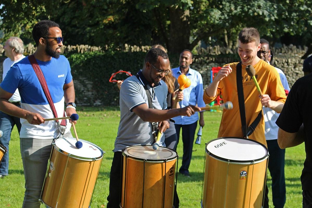 ACH staff at away day playing drums