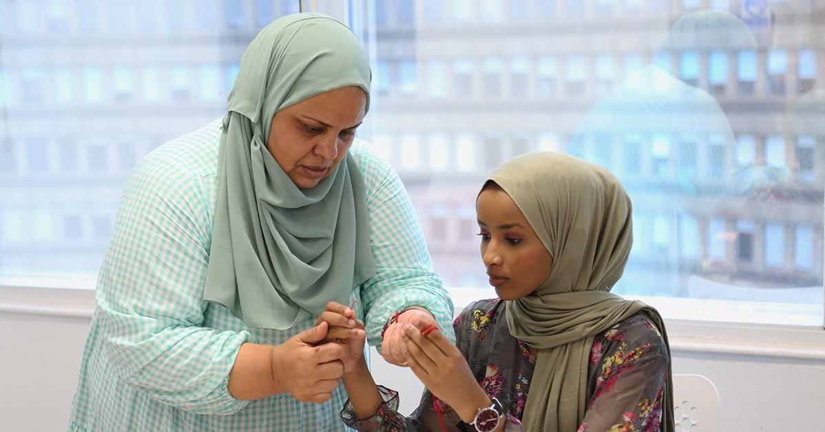 Two people crocheting