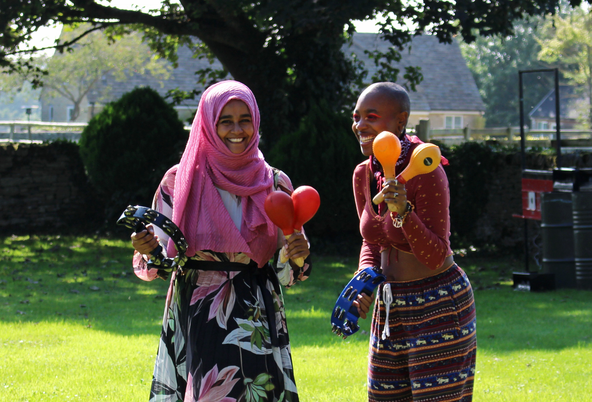 Two ACH staff playing instruments