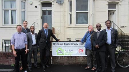 Bristol ACH standing outside the home of refugees
