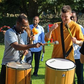 three people with drums