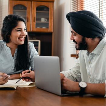 two people talking at table