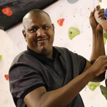 man on climbing wall