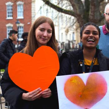 Picture of ACH team holding orange hearts